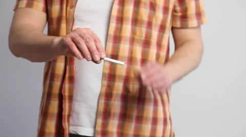 Man broking a cigarette and throwing away it Stock Footage 60408320
