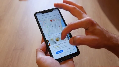 A Man browse Google Map of New York City on Mobile Phone Stock Footage 118519408