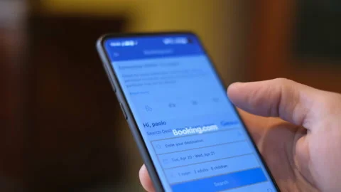 Man browse mobile booking app for search new travel destination on a smartphone Video stock 152767389