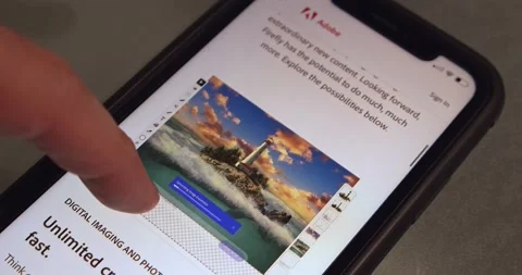 Man browses Adobe Firefly website seen in an iPhone screen Stock Footage 237294493