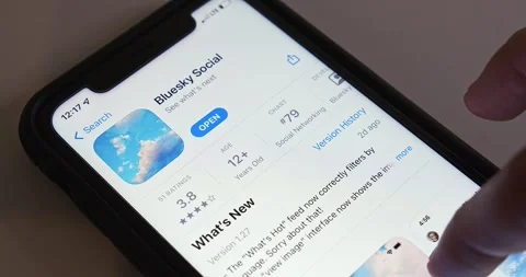 Man browses introduction of Twitter alternative Bluesky Social seen in App Store Stock Footage 240686167