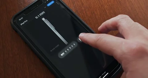 Man browses iPad Pro website seen in iPhone Stock Footage 274633884