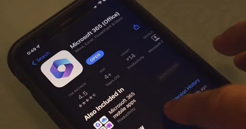 Man browses Microsoft 365 app introduction page in App Store on an iPhone Video stock 238649804