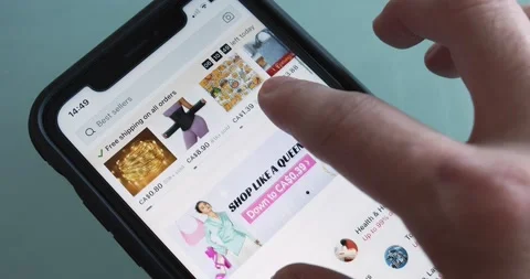 Man browses an US-based online marketplace Temu website seen in an iPhone Stock Footage 238404291