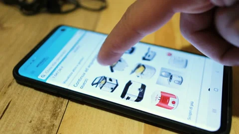 Man browsing on amazon shopping app on a smartphone,new offer,ecommerce business Stock Footage 133732674