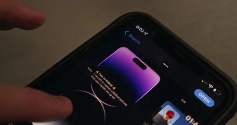 Man browsing App Store’s BeReal app page on iPhone Stock Footage 220405928