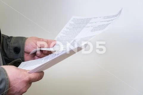 Man browsing business papers and documents Stock Photos
