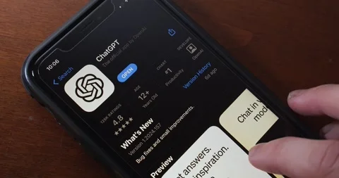Man browsing ChatGPT app in an App Store on an iPhone Video stock 277608645