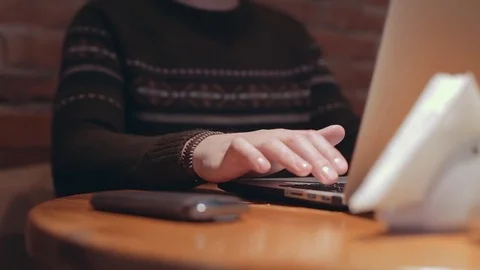 Man browsing in internet on mobile computer. Typing keyboard on laptop in cafe Stock Footage 76563020