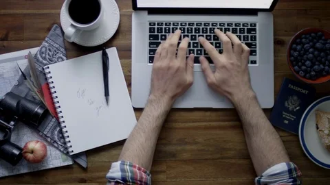 Man Browsing The Internet, Preparing For Travel - Red Scarlet-W Dragon In 4K Stock Footage 82374060