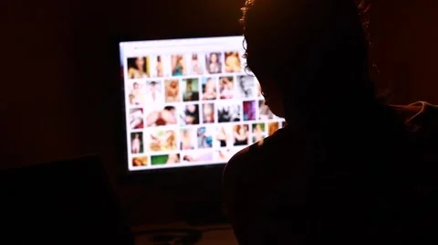 Man Browsing Internet ,viewing nude woman Stock Footage 67239799