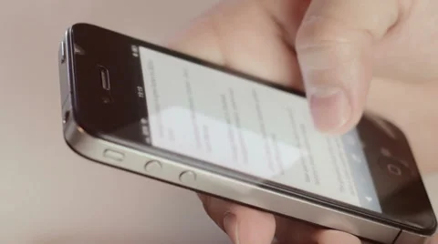 Man browsing news  mails on a smartphone Stock Footage 31971900