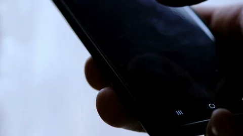 Man browsing smartphone netflix app series catalog,video streaming,quarantine Stock Footage 129550410