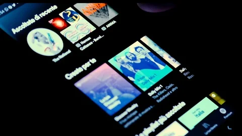 Man browsing Spotify App genre catalog On A Smartphone,streaming music platform Stock Footage 126939790