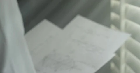 Man browsing through hand written notes 動画素材 76055084