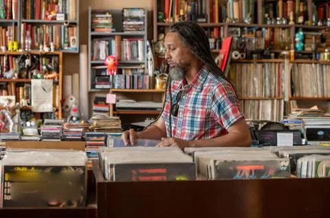 Man browsing through vinyl records Stock Photos