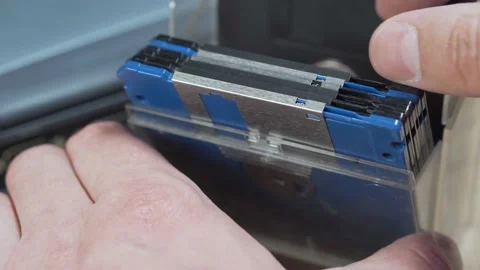 Man browsing vintage computer floppy disks in a storage box. Stock Footage 149423971