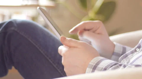 Man browsing web on tablet pc Stock Footage 34526032
