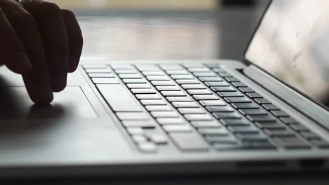 Man Browsing The Web Using The Touchpad of His Notepad, Laptop Computer Stock Footage