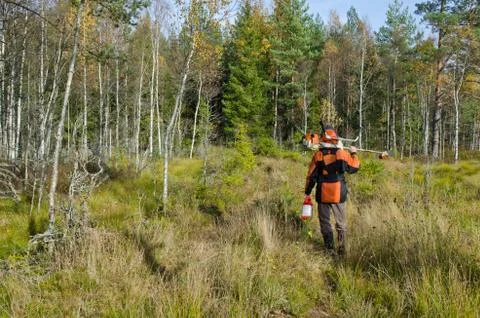 Man with a brush cutter Stock Photos