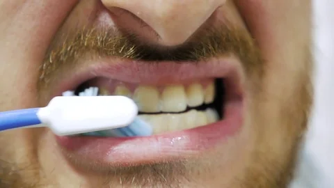 The man brushes his teeth Stock Footage 106748889