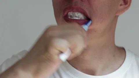 The man brushes his teeth with toothbrush with paste close-up. Stock Footage 162898845