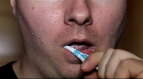Man brushing his teeth in the morning Stock Footage 36645762