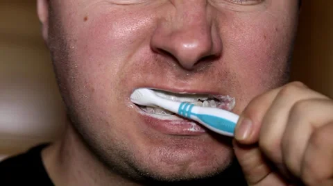 Man brushing his teeth in the morning Stock Footage 36645778