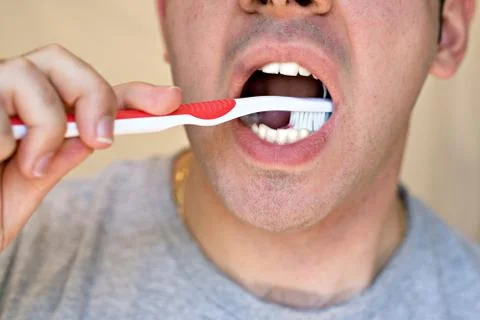 Man Brushing His Teeth Stock Photos
