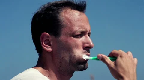 Man brushing his teeth, slow motion shot at 120fps Stock Footage