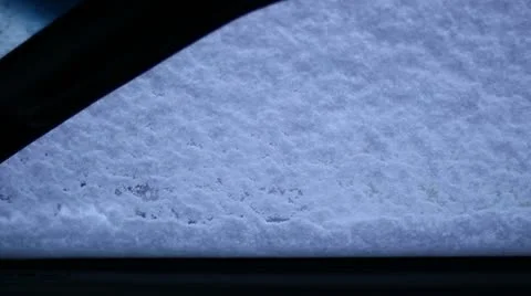 Man brushing snow off of car from inside car 스톡 동영상 17914763