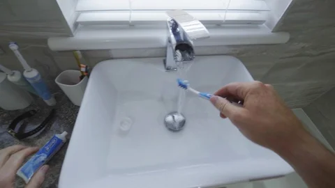 Man Brushing Teeth in bathroom, point of view, first person, 4K Stock Footage 113826193