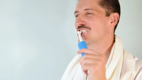 Man  brushing teeth. Daily hygiene, oral care, teeth whitening Stock Footage 165383001