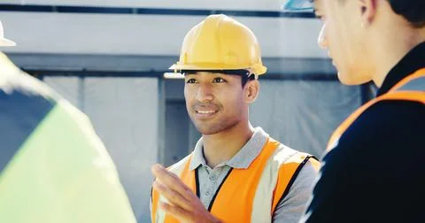 Man, builder and discussion with team on construction site for building design Stock Photos
