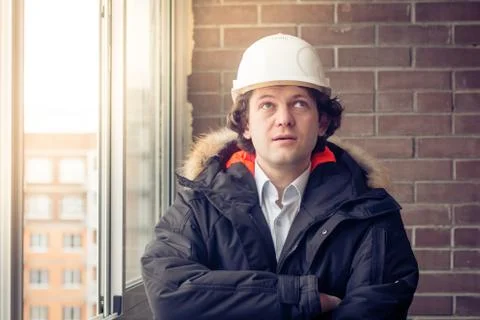 Man builder. Builder in protective clothing and helmet. Male builder. Portrait Stock Photos