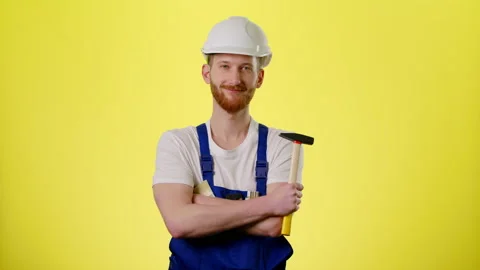 Man Builder Engineer Worker In Hard Hat Helmet With A Hammer Standing And Smile Stock Footage 170187775