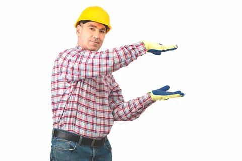 A man builder   presenting empty hands over isolated background Stock Photos