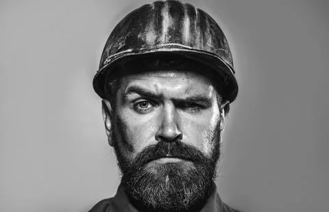 Man builder. Serious construction worker in hard hat. Handsome engineer, fo.. Stock Photos