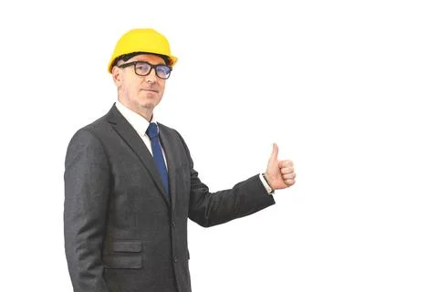 A man builder in a suit  presenting empty hands over isolated background Stock Photos