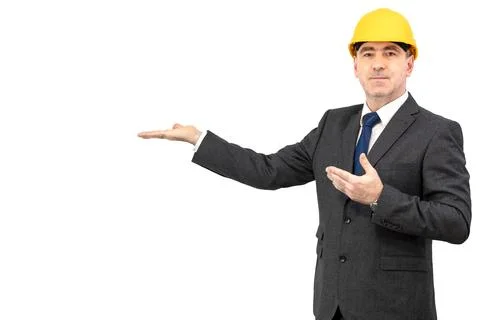 A man builder in a suit  presenting empty hands over isolated background Stock Photos
