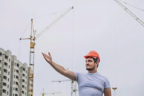 Man the Builder working foreman in the helmet to ensure safety on the constru Stock Photos