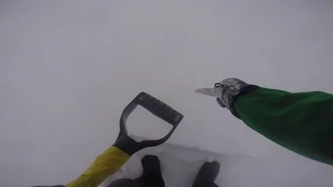 Man building an igloo Stock Footage 79978267