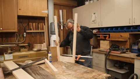 Man building table legs project in workshop Stock Footage 102045521