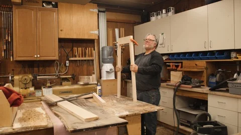 Man building table legs project in workshop Stock Footage 102045526