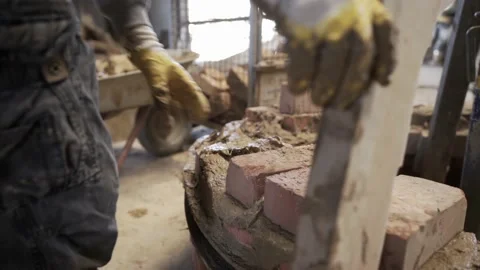 Man Builds Brick Wall for Bell Casting Mold with Traditional Technique Video stock 221425407