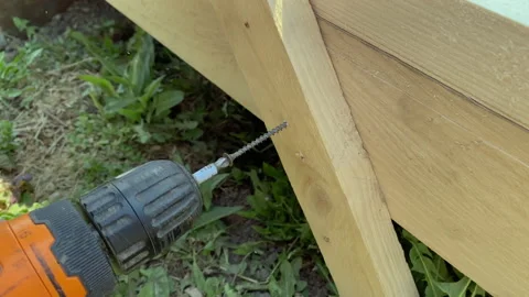 A man builds the frame of a gazebo. Stock Footage 154201607