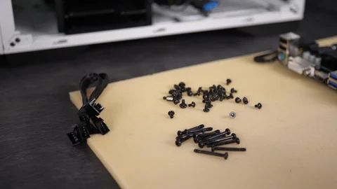 Man builds personal desktop computer, technician assembles components into case. Stock Footage 129027149