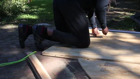 Man builds a skateboard half pipe Video stock 321689733