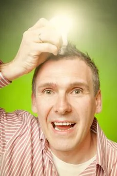 Man with bulb Stock Photos