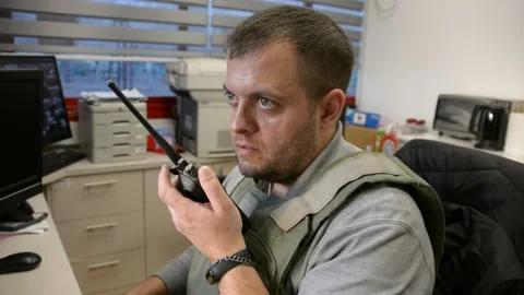 Man in bulletproof vest in security room. selective focus, Stock Footage 172364788